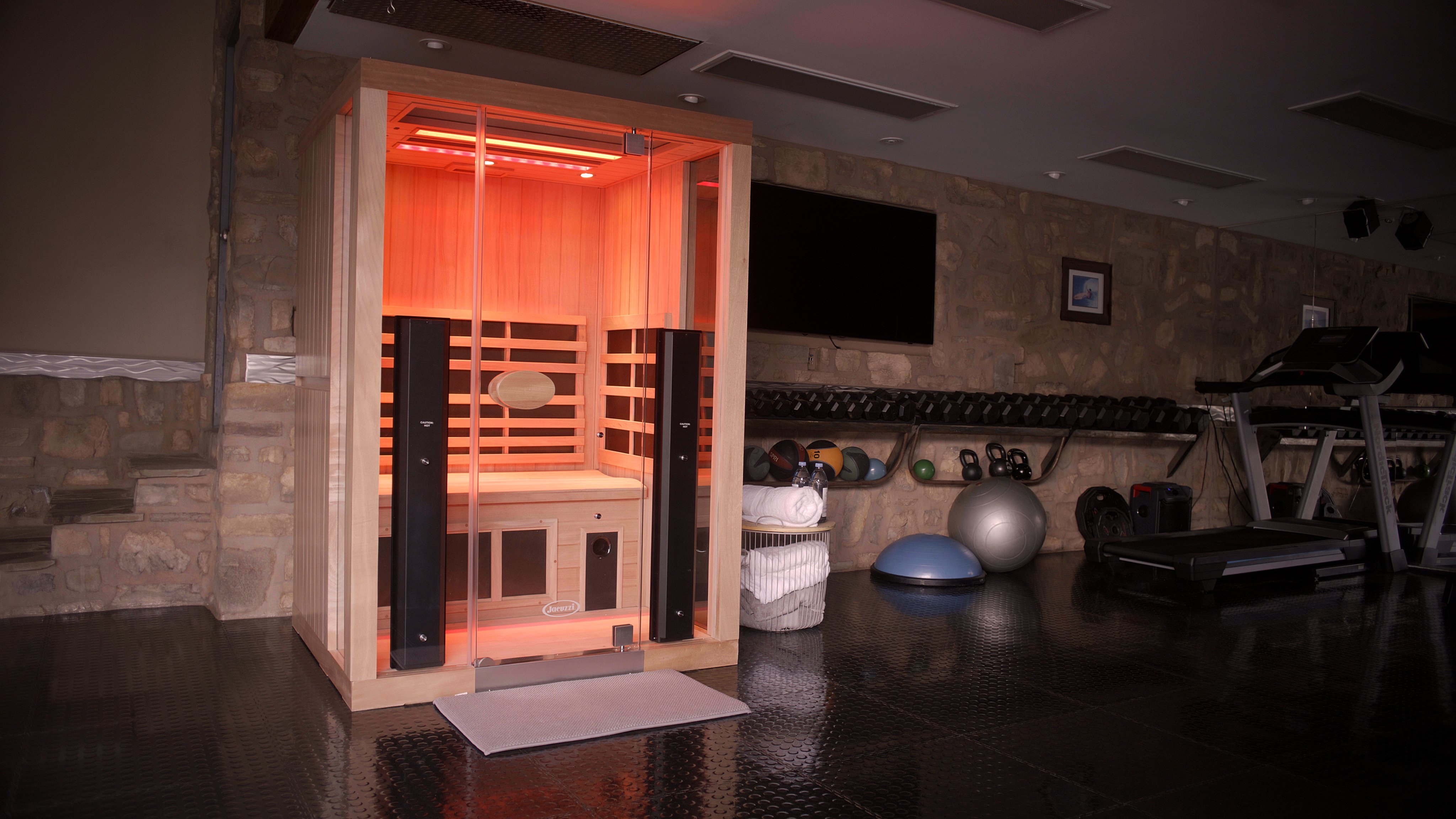 Jacuzzi infrared sauna installed in a home gym