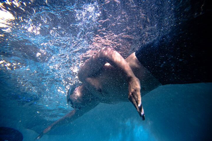 Swimmer training against the current in a Jacuzzi swim spa